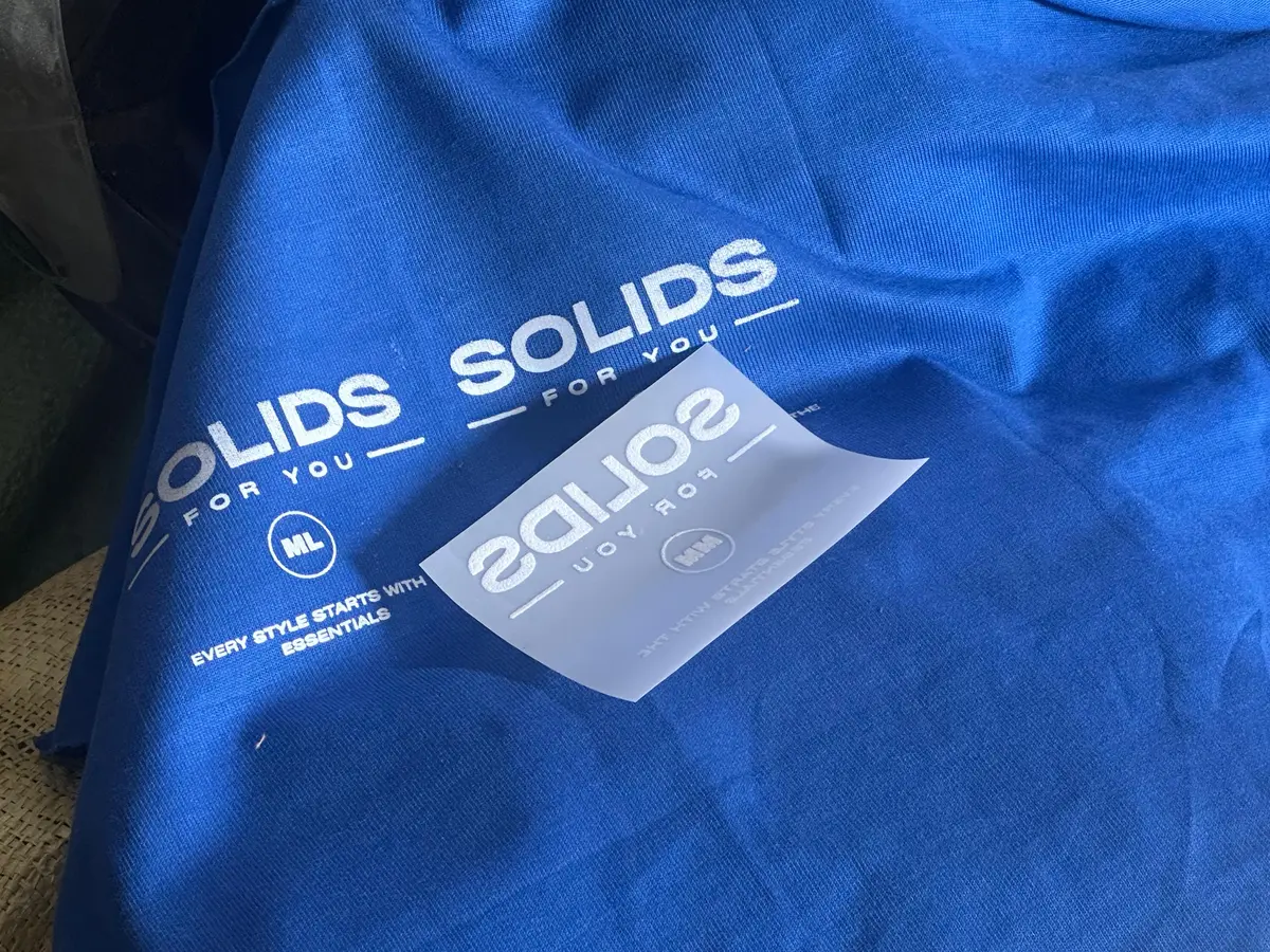 Close-up of Solid Blue SFY cotton with the printed neck label